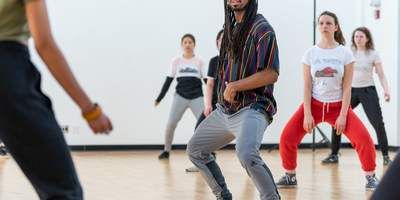 Quilan Arnold demonstrates a squat in hip hop class at Bard
