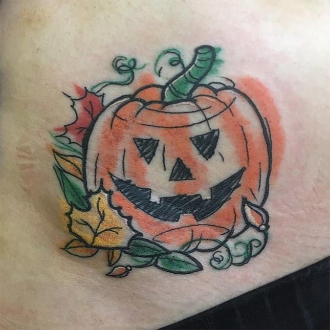 Premium Vector  Pumpkin halloween tattoo monoline