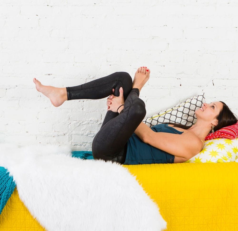 6 Lazy Girl Yoga Poses You Can Do Without Leaving Your Bed - Brit + Co