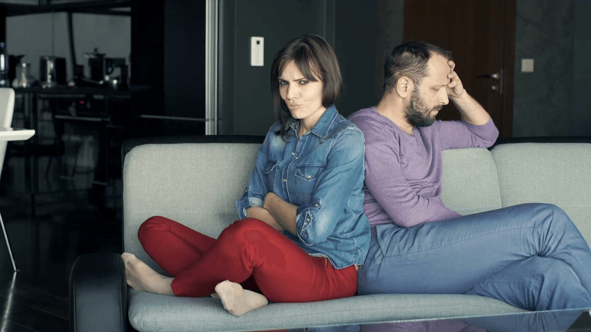 offended angry couple sitting on sofa at home bwshpdfq  F0000