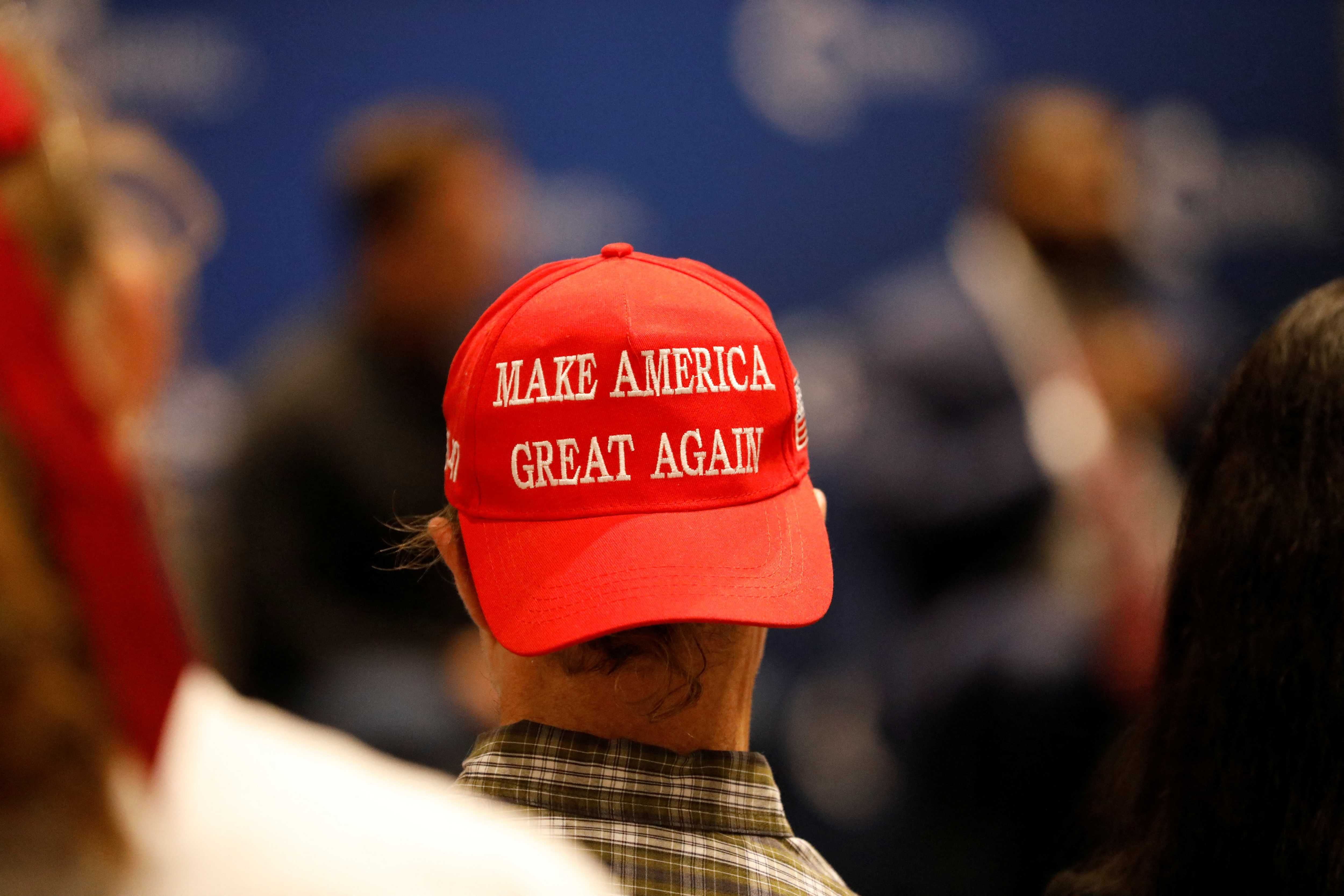 A college student wearing a \u201cMake America Great Again\