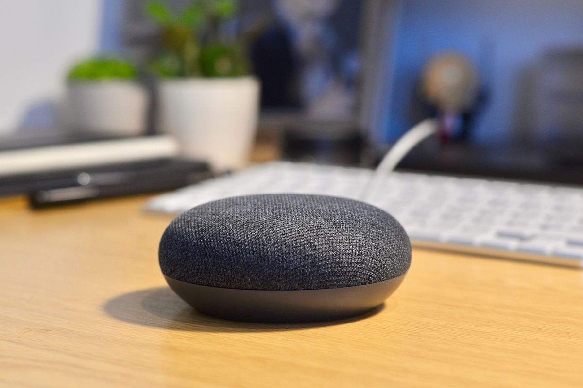 a photo of Google Home Mini on a desk