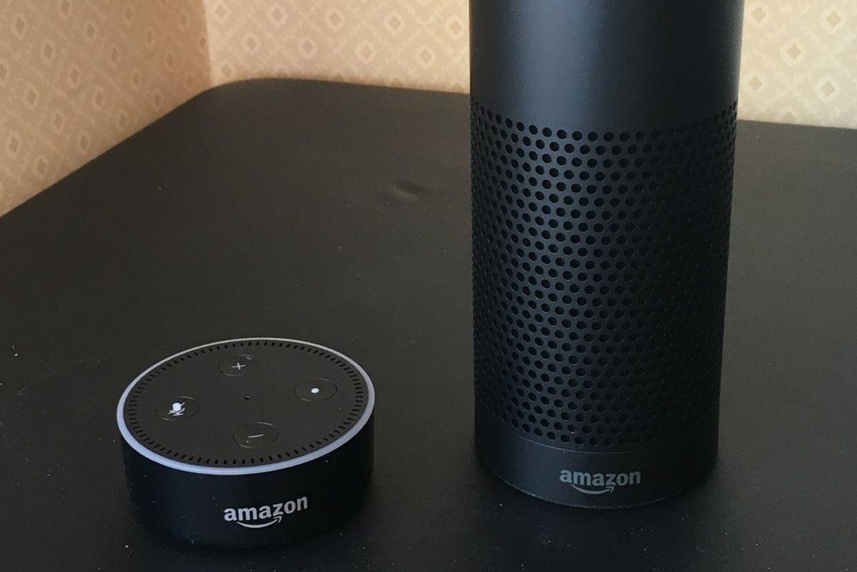 Photo of 1st Gen Amazon Echo and Echo Dot on a table.