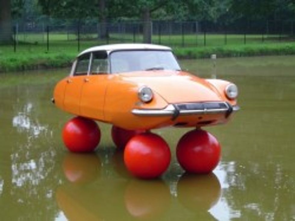 Ghost Breitbart: Romney Wins Crucial First Hurricane Photo Op With Campaign Bus While Obama Is Lazy, Possibly Shiftless