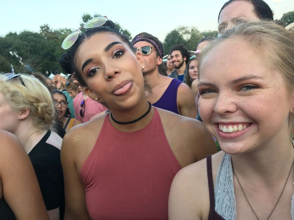 college girl friends partying at outdoor summer concert