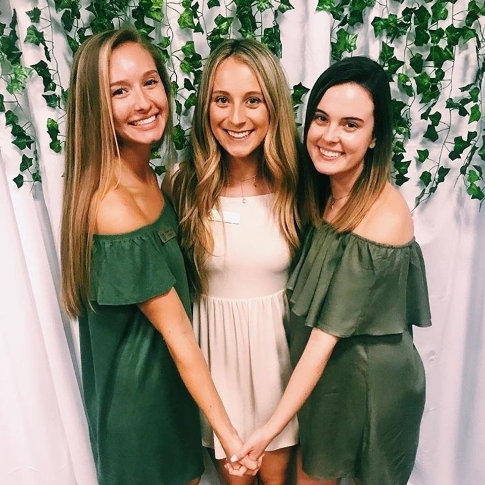 Three sorority girls smiling