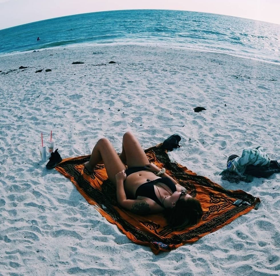 Girl Laying On Beach