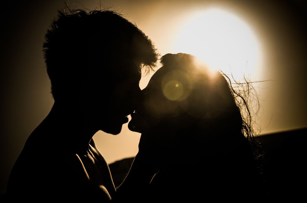 https://www.pexels.com/photo/silhouettes-of-couple-kissing-against-sunset-41068/