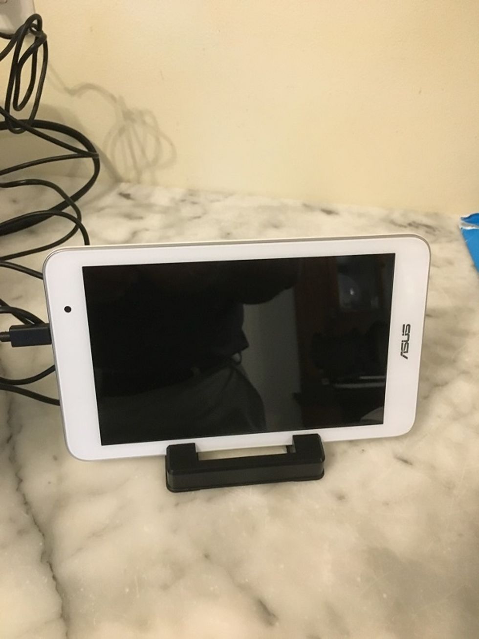 Photo charging Lifeshield's wireless security touchpad on a counter.