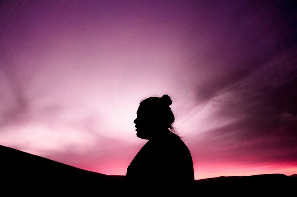 woman purple sky
