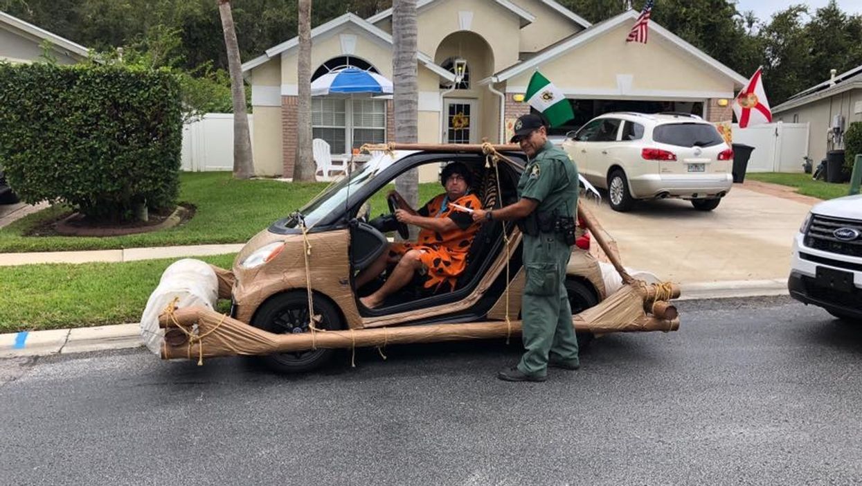 Man dressed as Fred Flintstone pulled over in his prehistoric-looking car in Florida