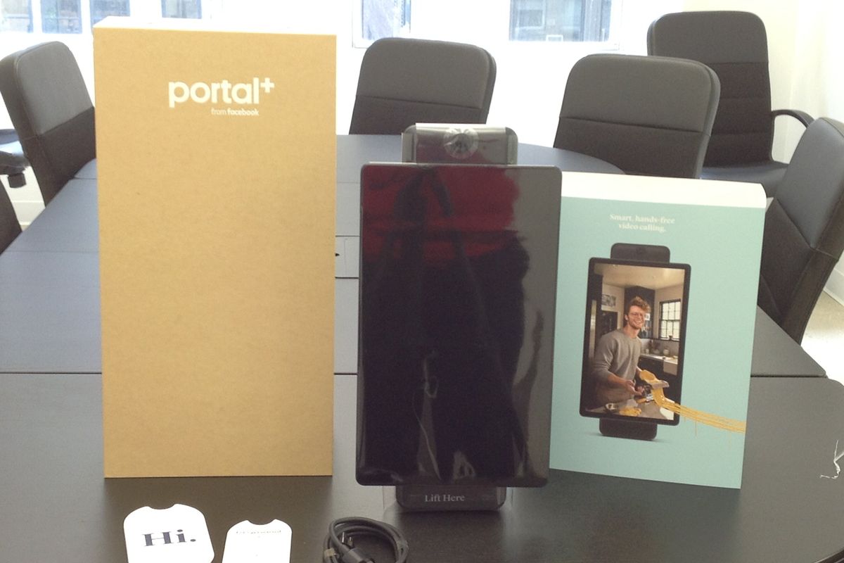 A photo of Facebook Portal Plus unboxed on a conference table