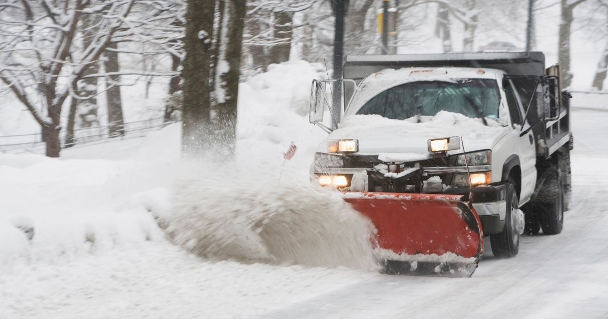 Snow Plow Driver Gets A Shock After Finding Car Buried In Snow With Driver Still Inside