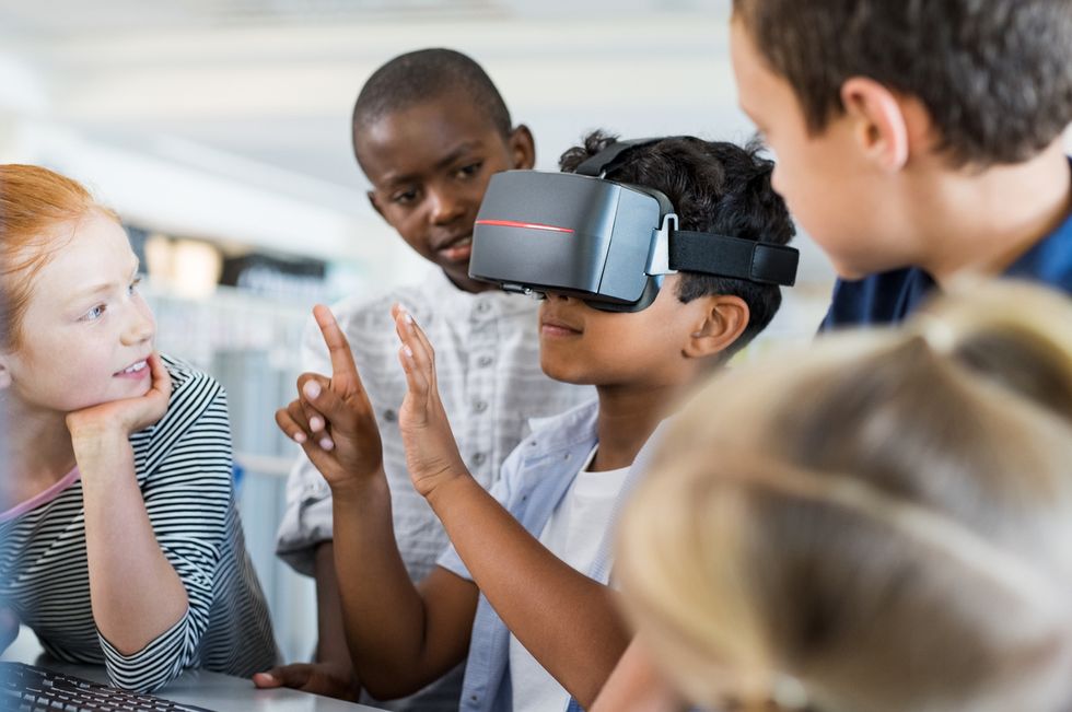 a photo of a student using a VR headset
