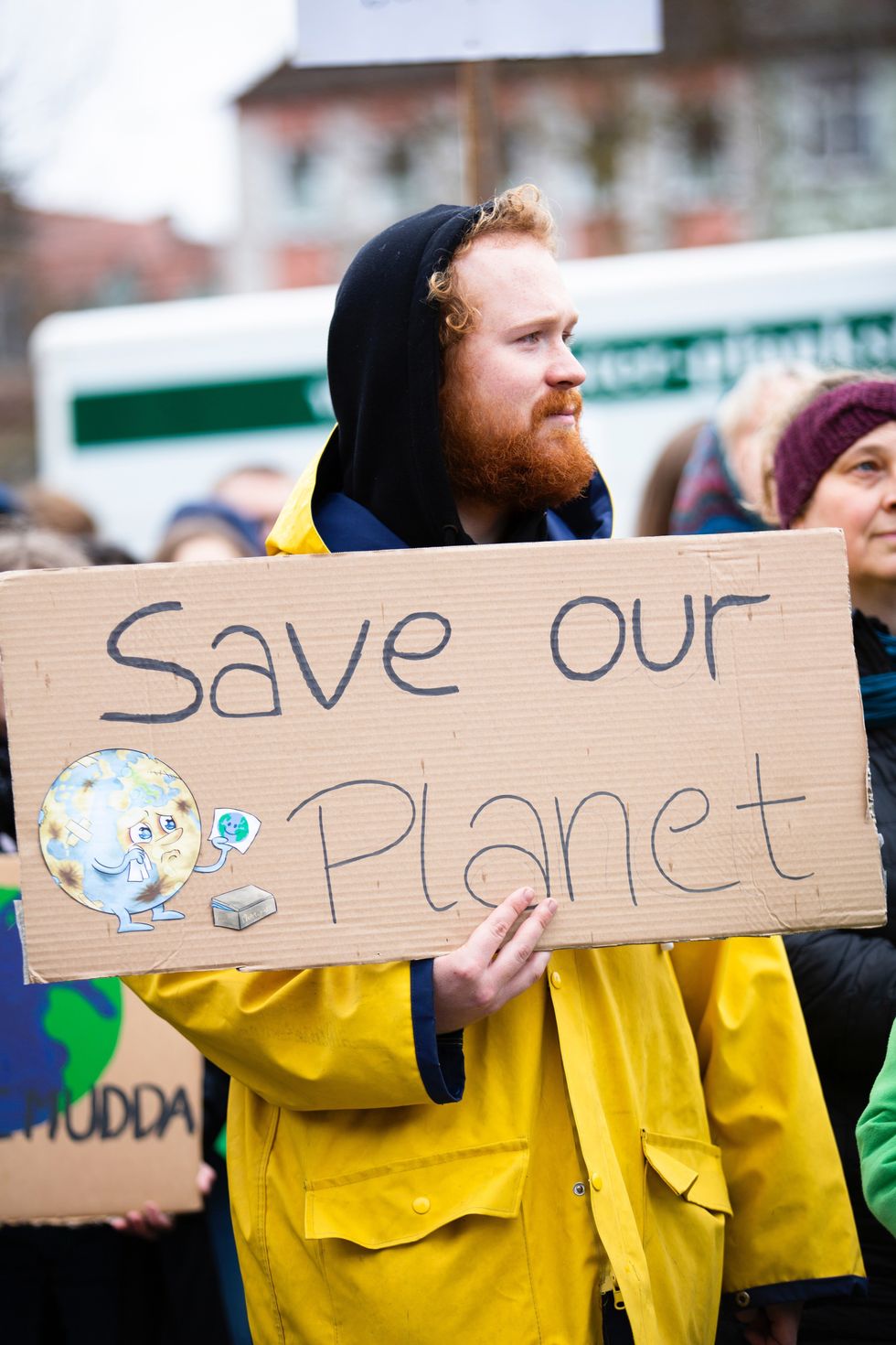 https://www.pexels.com/photo/person-holding-save-our-planet-sign-2027058/