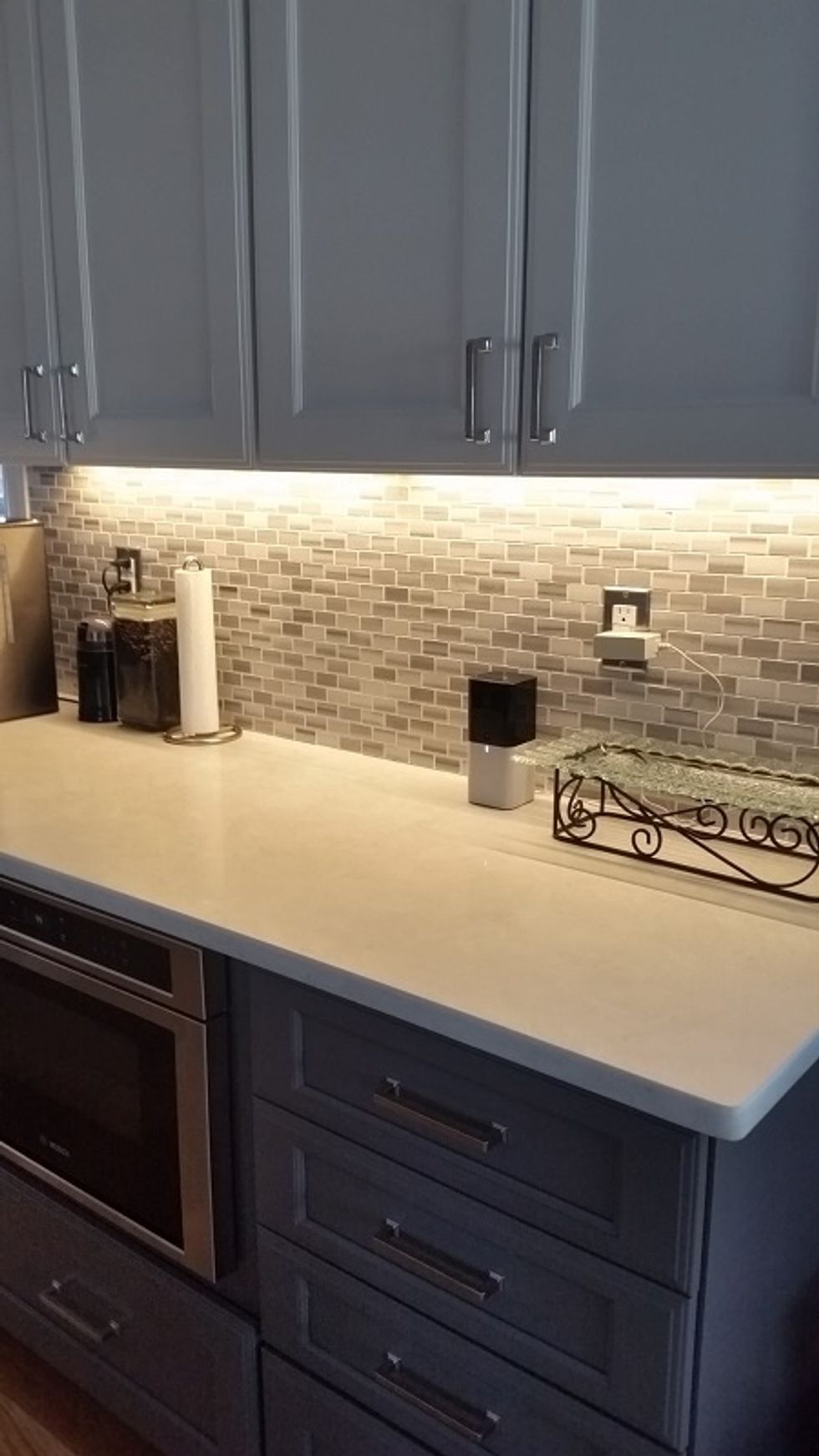 a photo of abode iota hub on a counter.