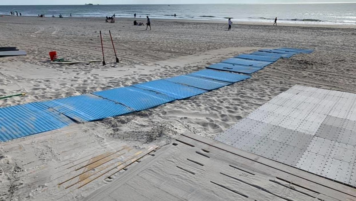 Volunteers build flooring so people with disabilities can access the beach in North Carolina