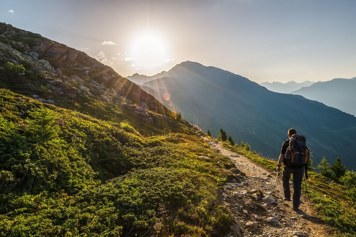 stock image of a man backpacking