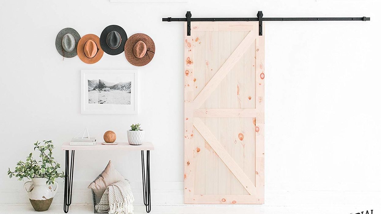 There's a DIY sliding barn door kit for sale on Amazon
