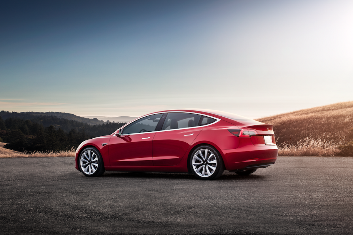 Photo of red Tesla Model 3
