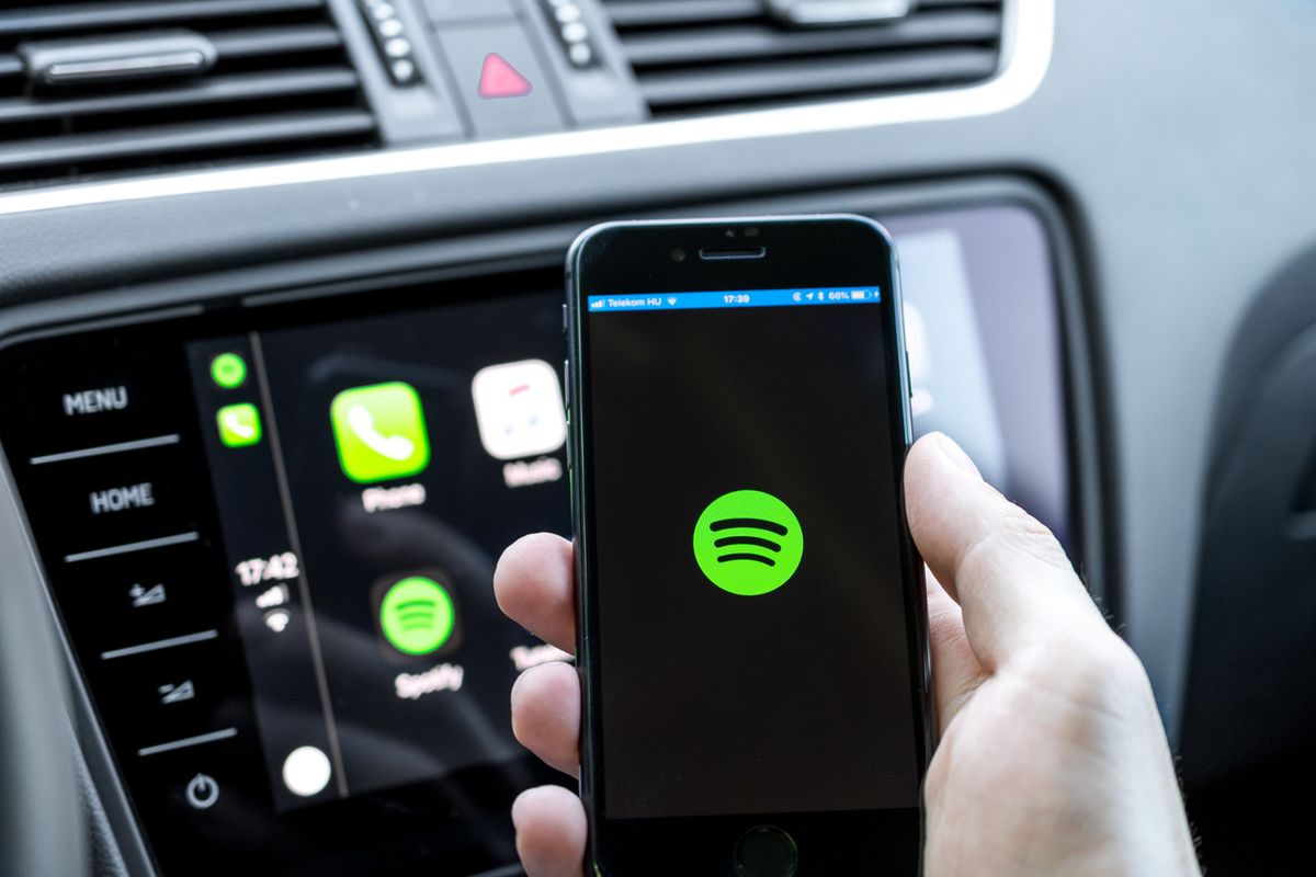 Photo of Spotify on a smartphone in a car