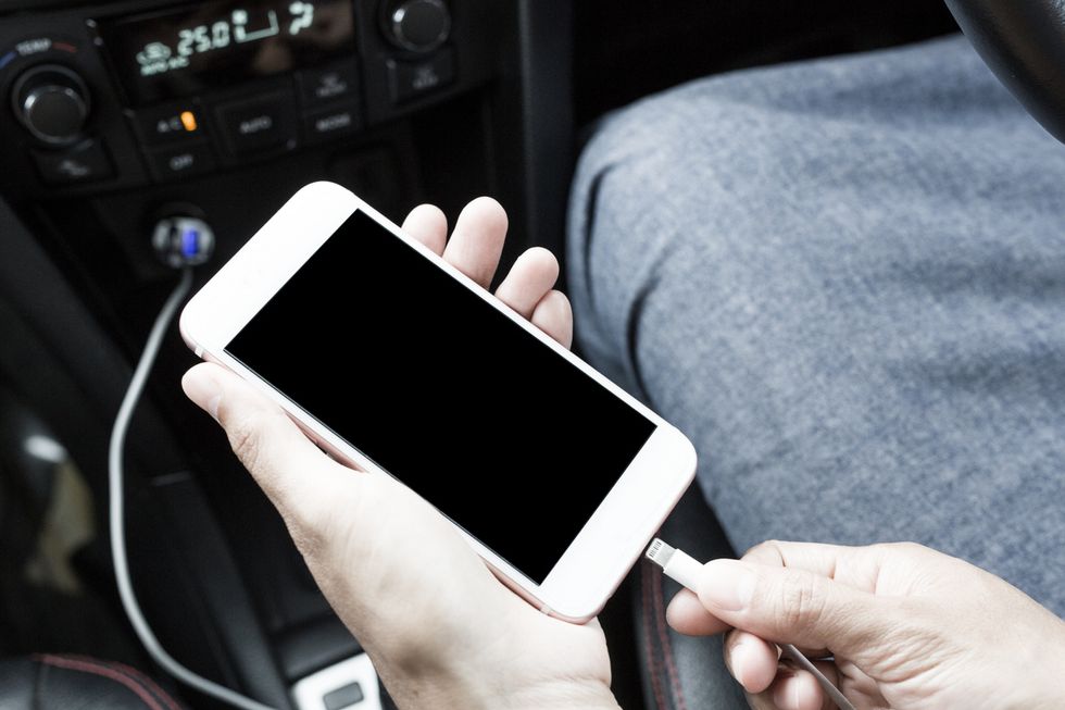 Photo of phone plugged into car USB port