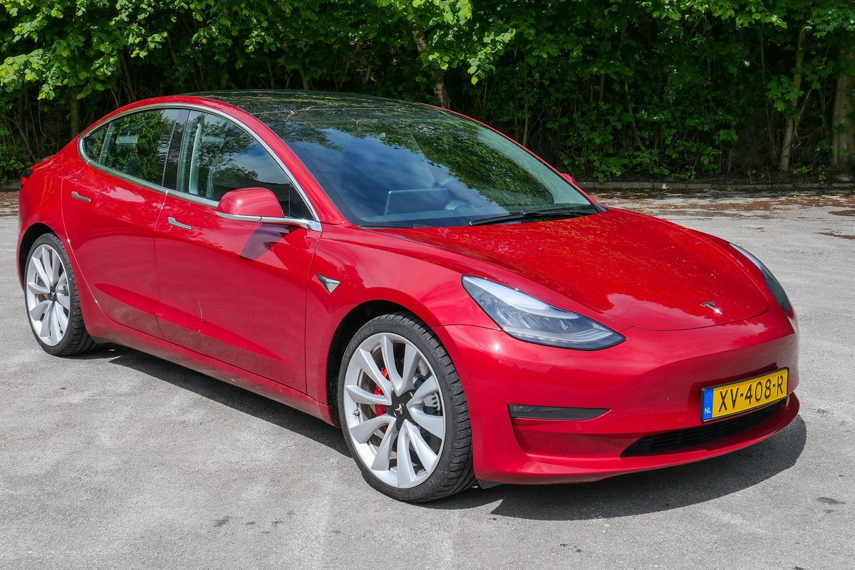 Photo of a red Tesla Model 3