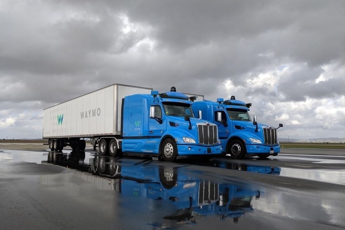 Photo of a pair of autonomous trucks by Waymo