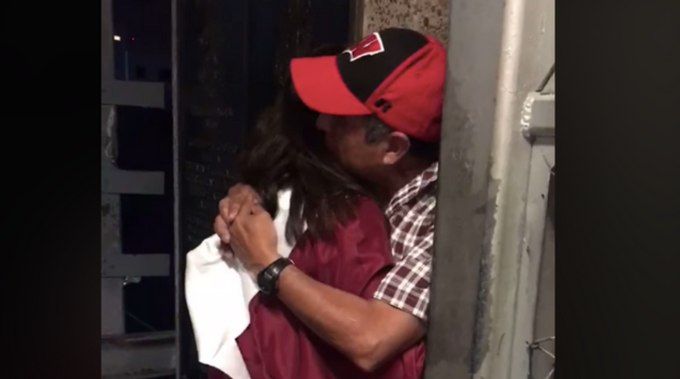 These photos of a high school grad embracing her Dad at the border reminds us what’s at stake in the immigration debate.