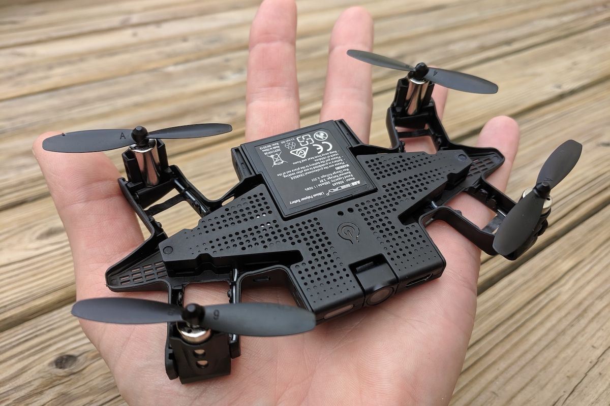 Small black drone in a palm of a hand