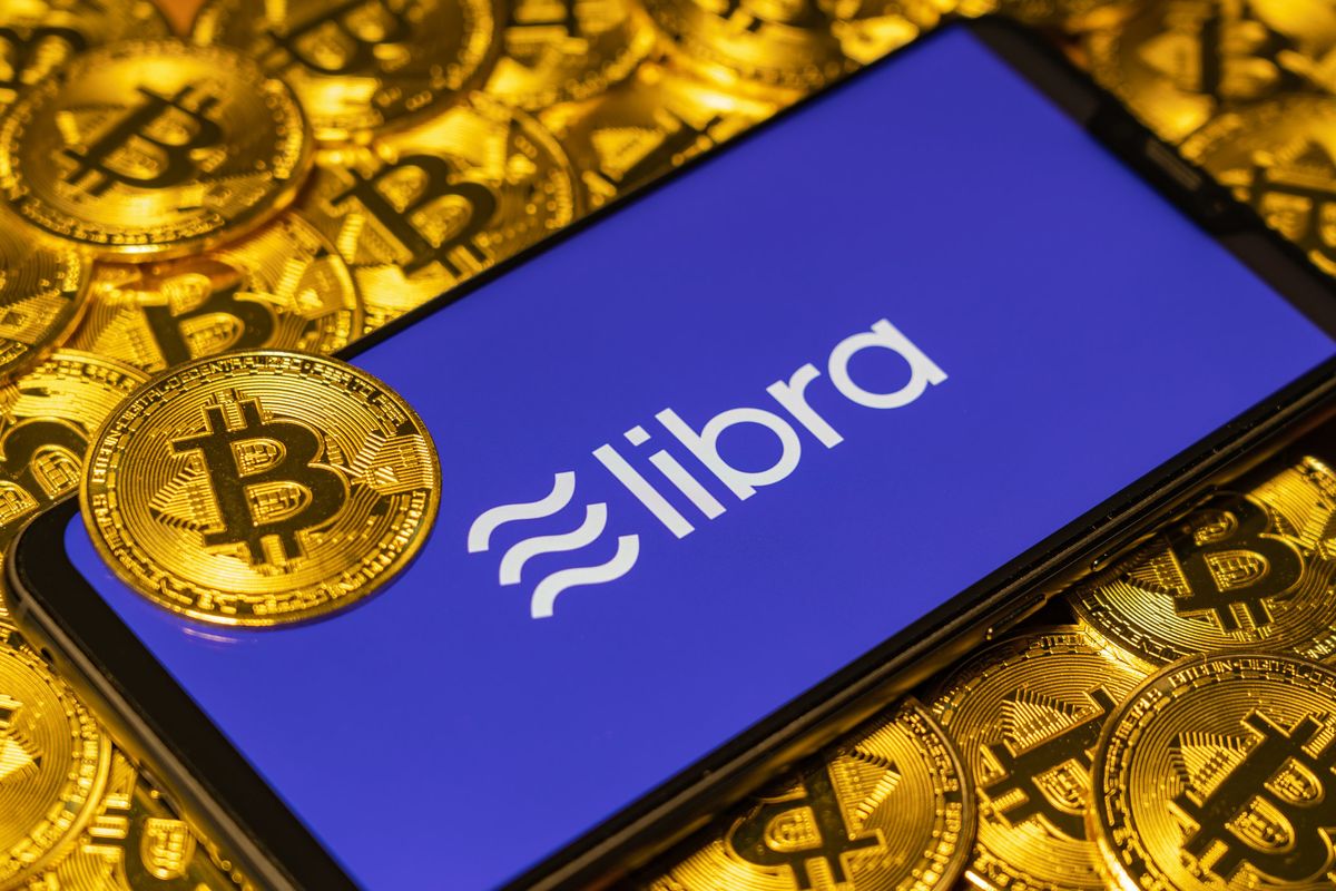 Stock image showing Facebook Libra and bitcoins