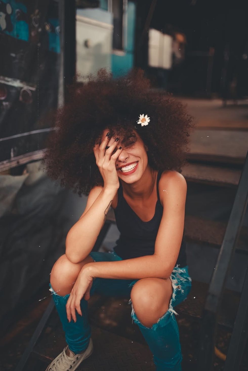 https://www.pexels.com/photo/photo-of-woman-sitting-on-stairs-1848565/