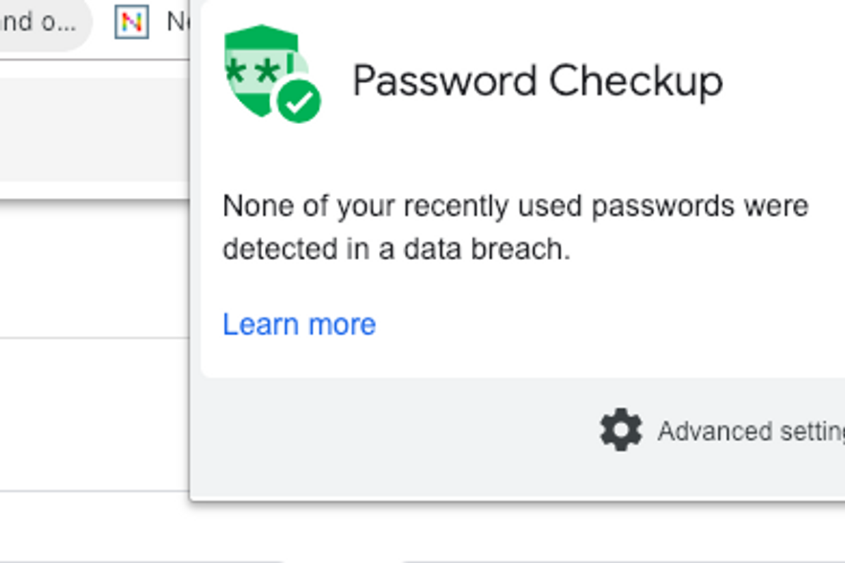A green badge symbol for Password Checkup on a computer screen