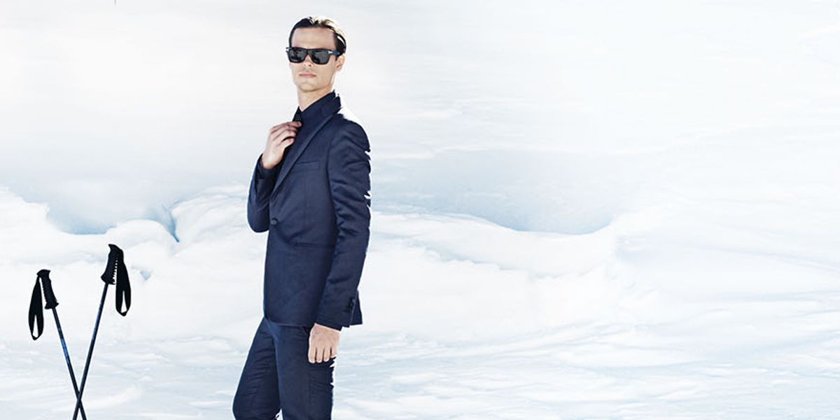 Criminal Minds’ Matthew Gray Gubler wears a blue suit while posing on a snowy ski trail.