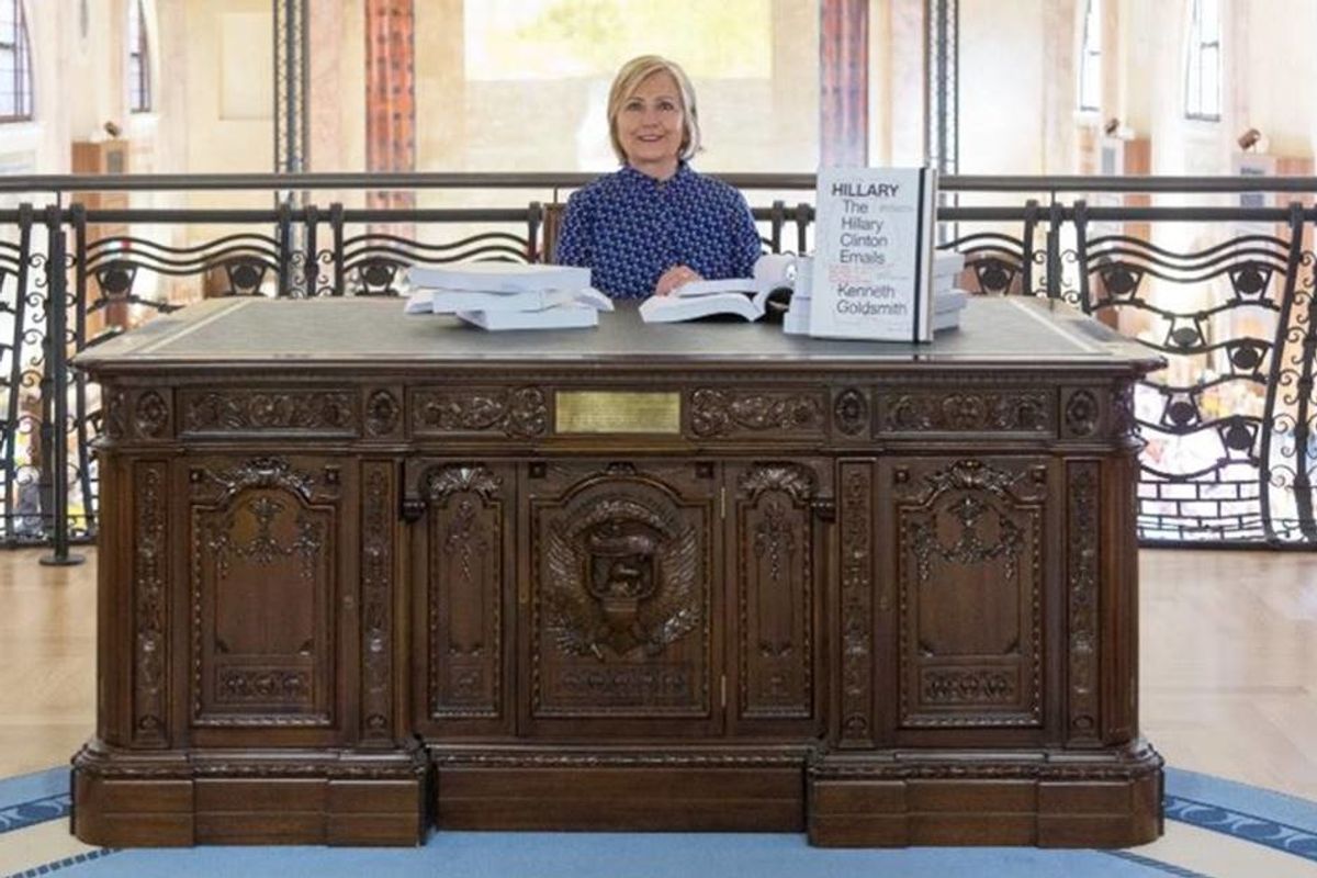 Hillary showed us what might have been as she sat at an Oval Office desk at an art exhibit