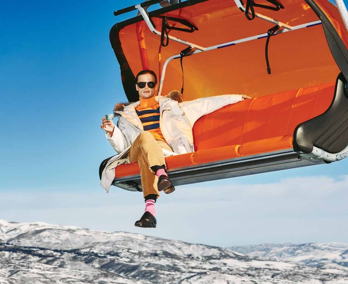 Matthew Gray Gubler of Criminal Minds drinking tea and wearing a puffy coat on a ski lift