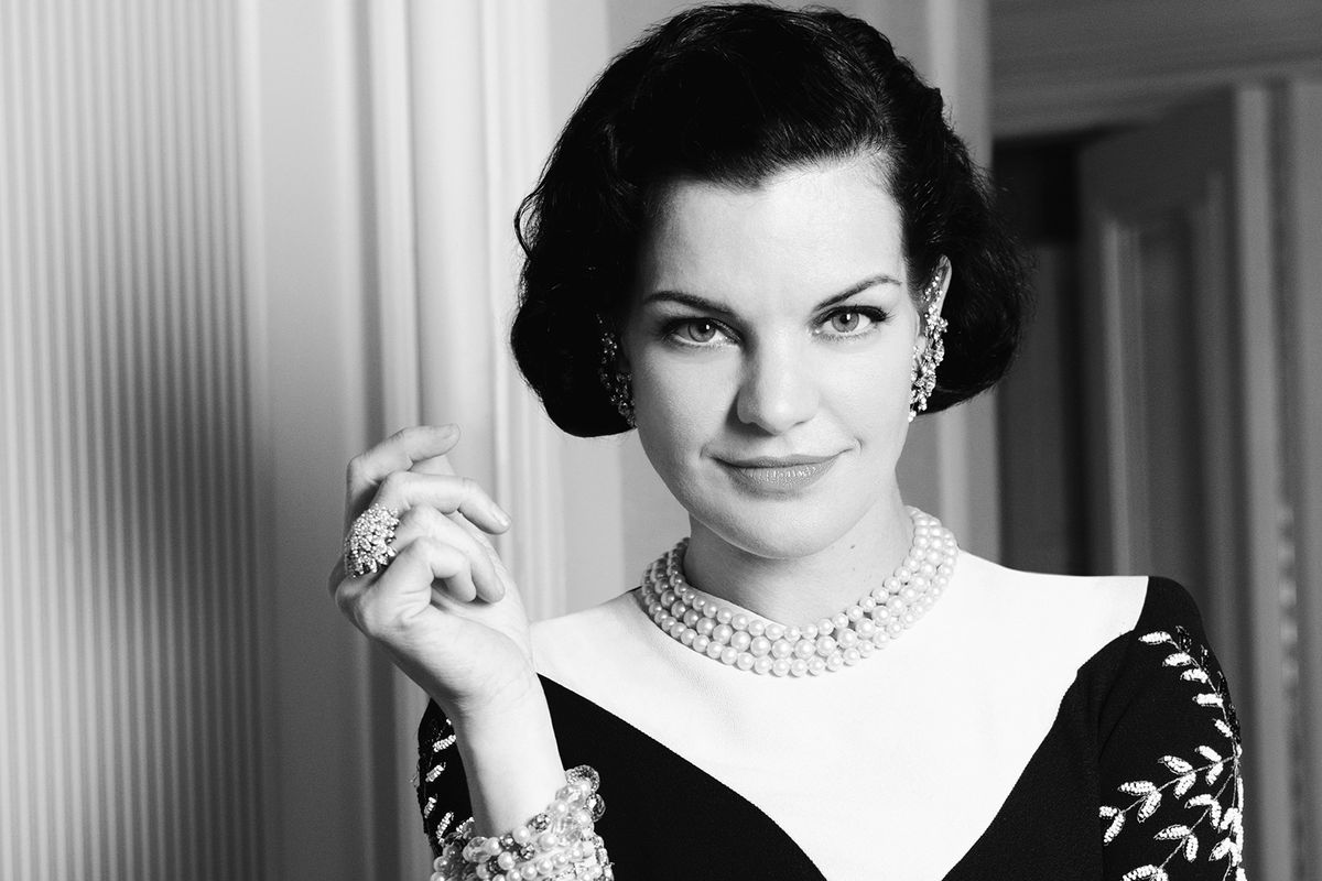 Black and white image of Actress Pauley Perrete in pearls.