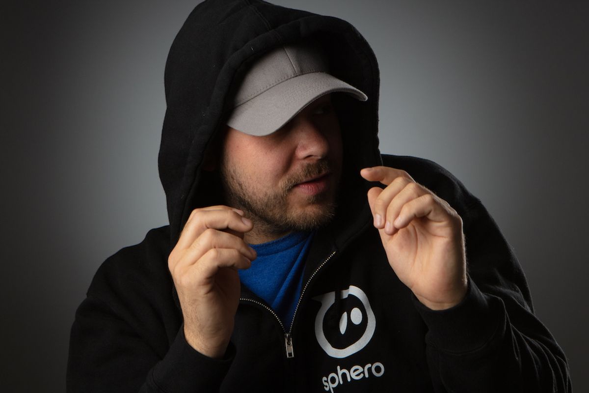 Sphero's founder Adam Wilson wearing a hoodie and a baseball cap