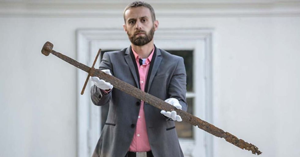 Construction Worker Uncovers Medieval Sword in Peat Bog