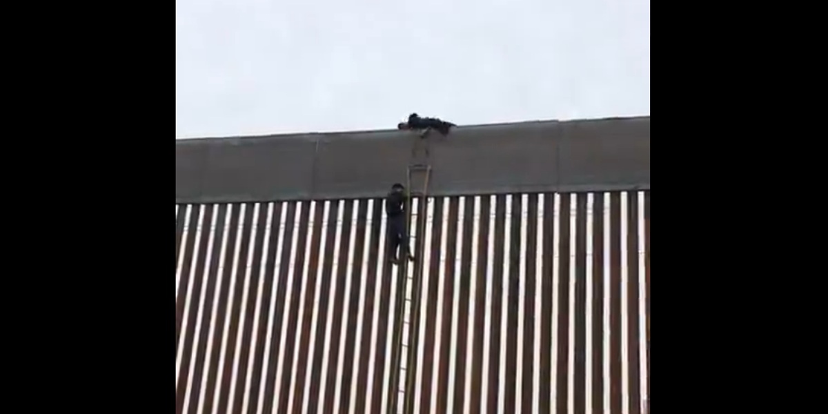 Viral video shows people climbing up the new USMexico border wall and