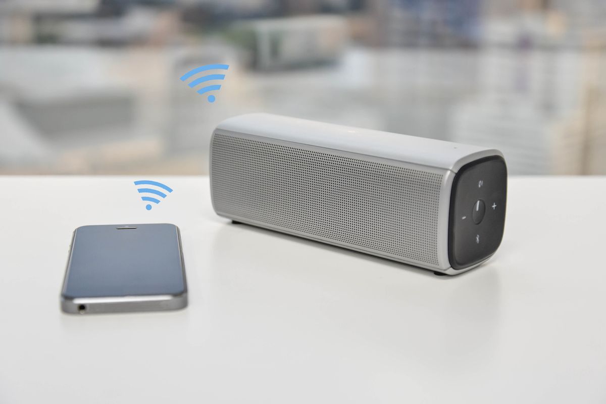Stock image of smartphone and Bluetooth speaker
