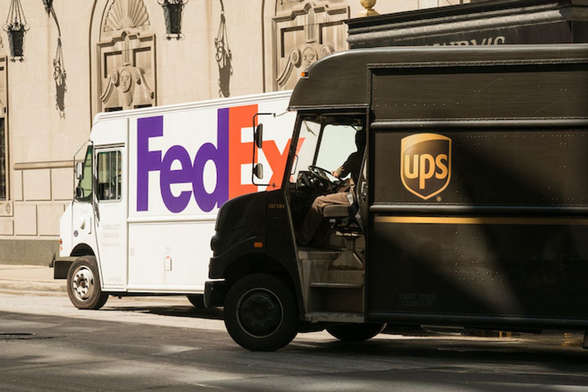 Federal Express and UPS delivery trucks