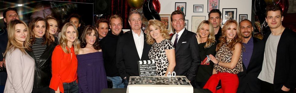 The Young and The Restless cast gathered around a cake celebrating Melody Thomas Scott's 40 years on the show