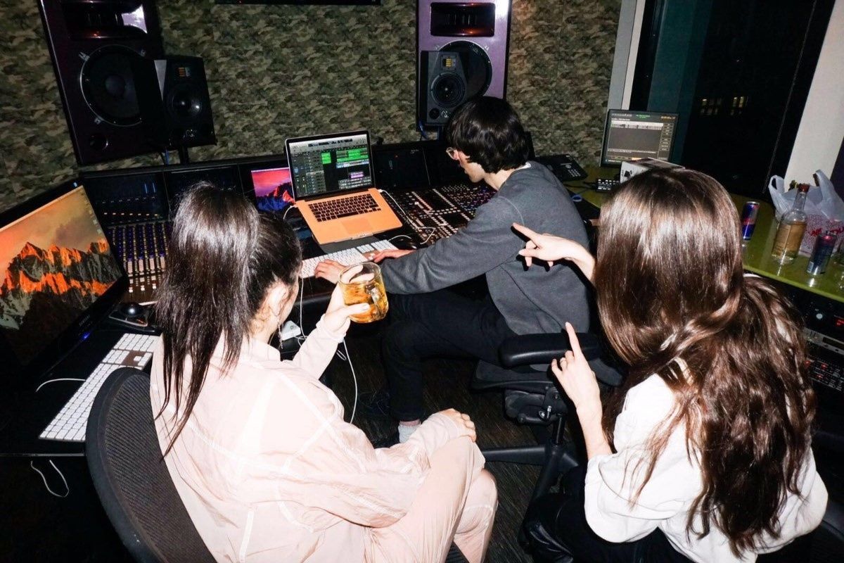 A. G. Cook in the studio with Charli XCX and Caroline Polachek.