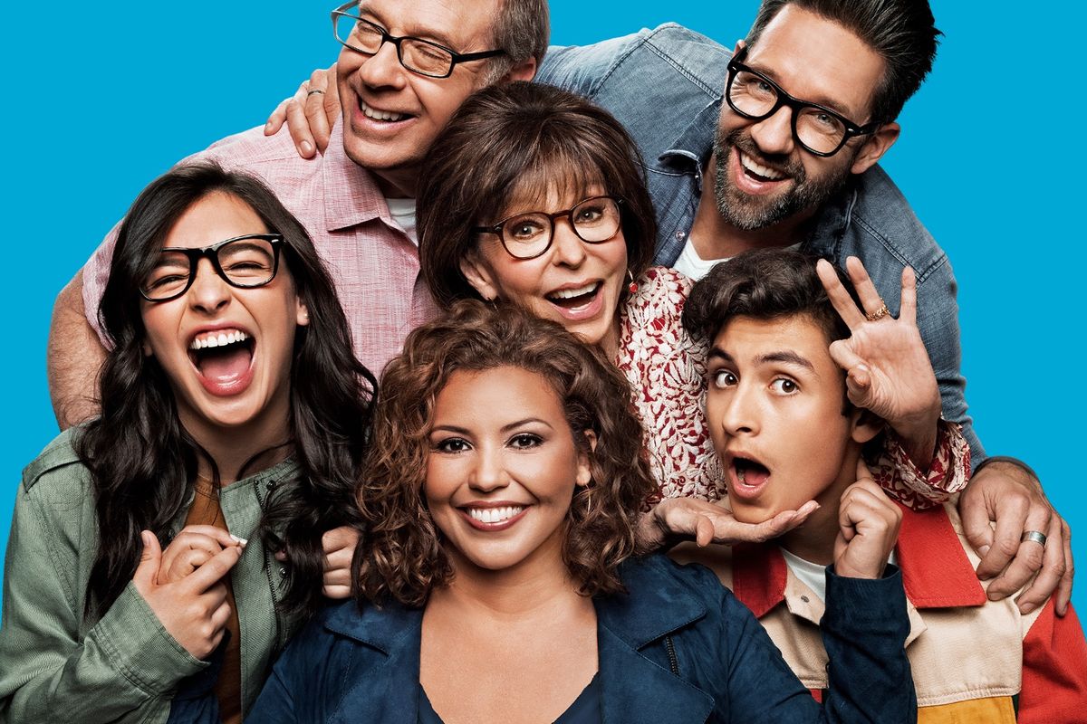 The cast of One Day At A Time smiles for the camera.