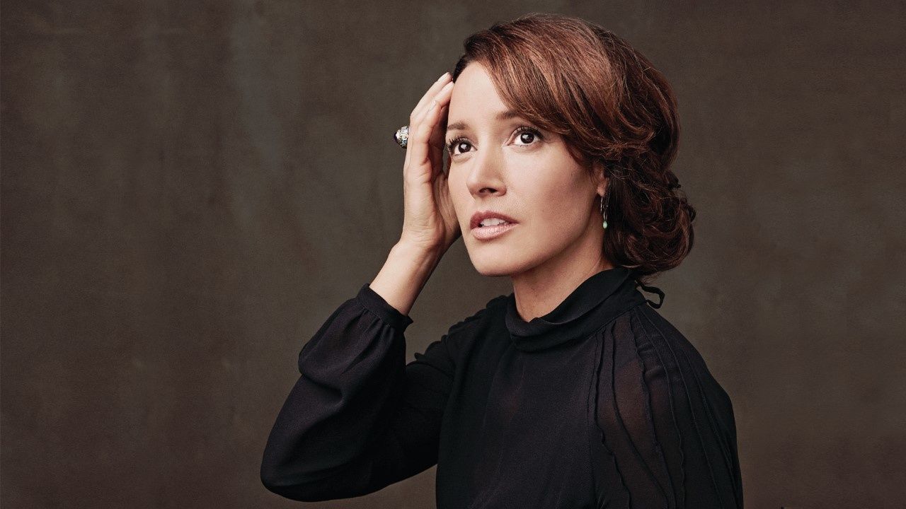 Jennifer Beals wearing a black top while looking off in the distance.