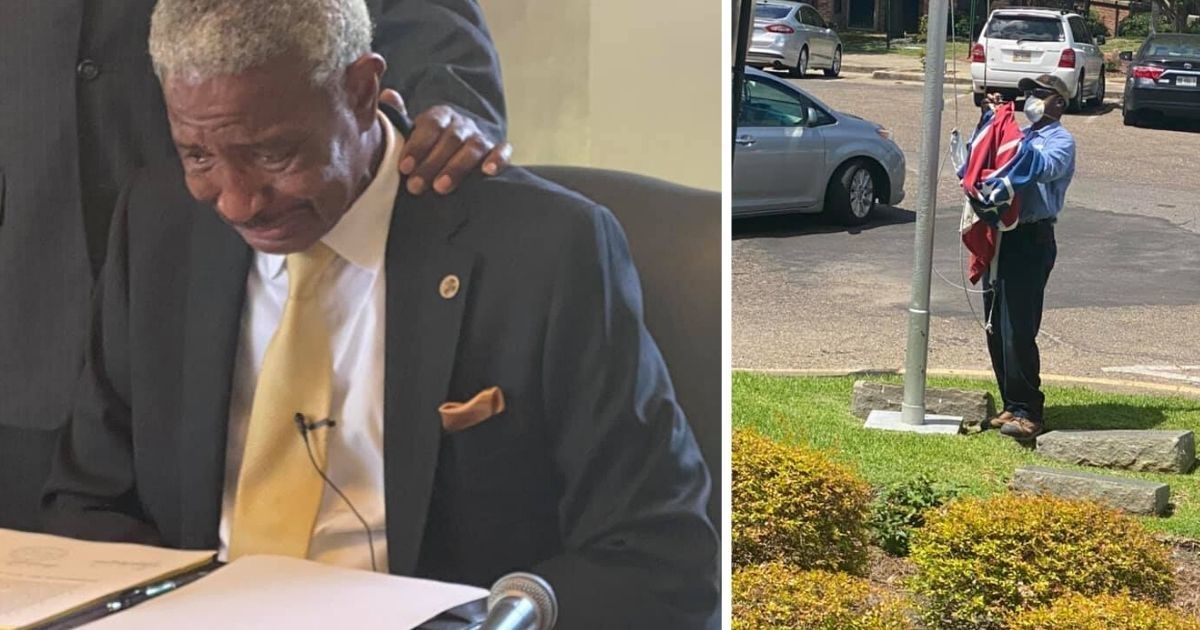 Mississippi town mayor fights back tears as he signs order to remove