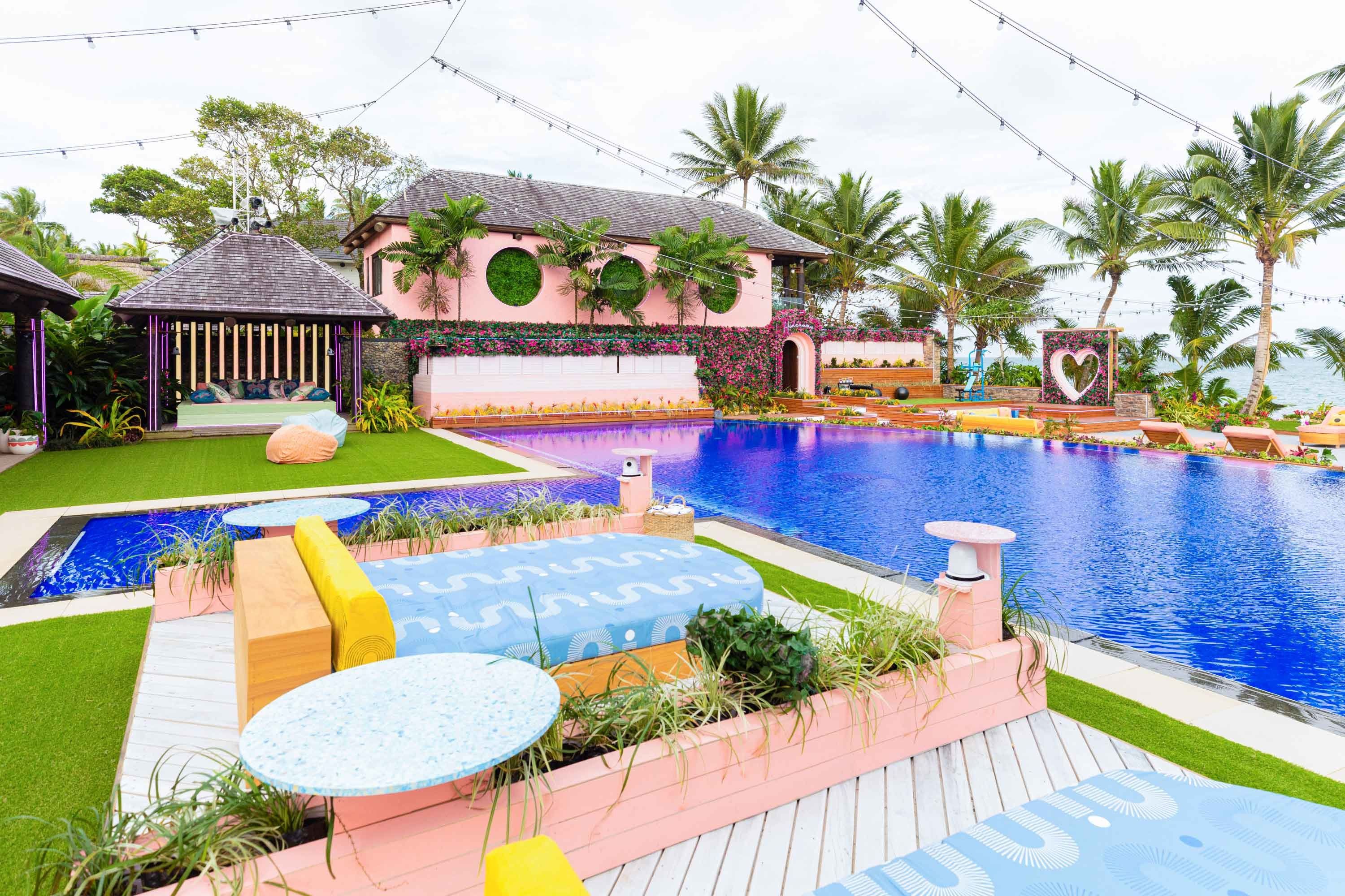 The Love Island outdoor set with pool and hip lounge areas.