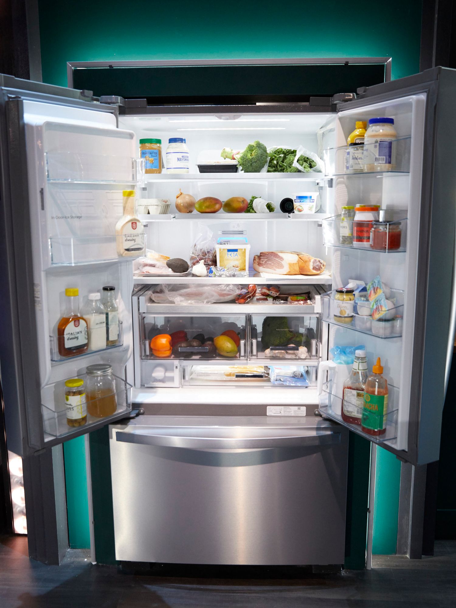 Fridge Wars refrigerator stocked with leftover fruits veggies and condiments