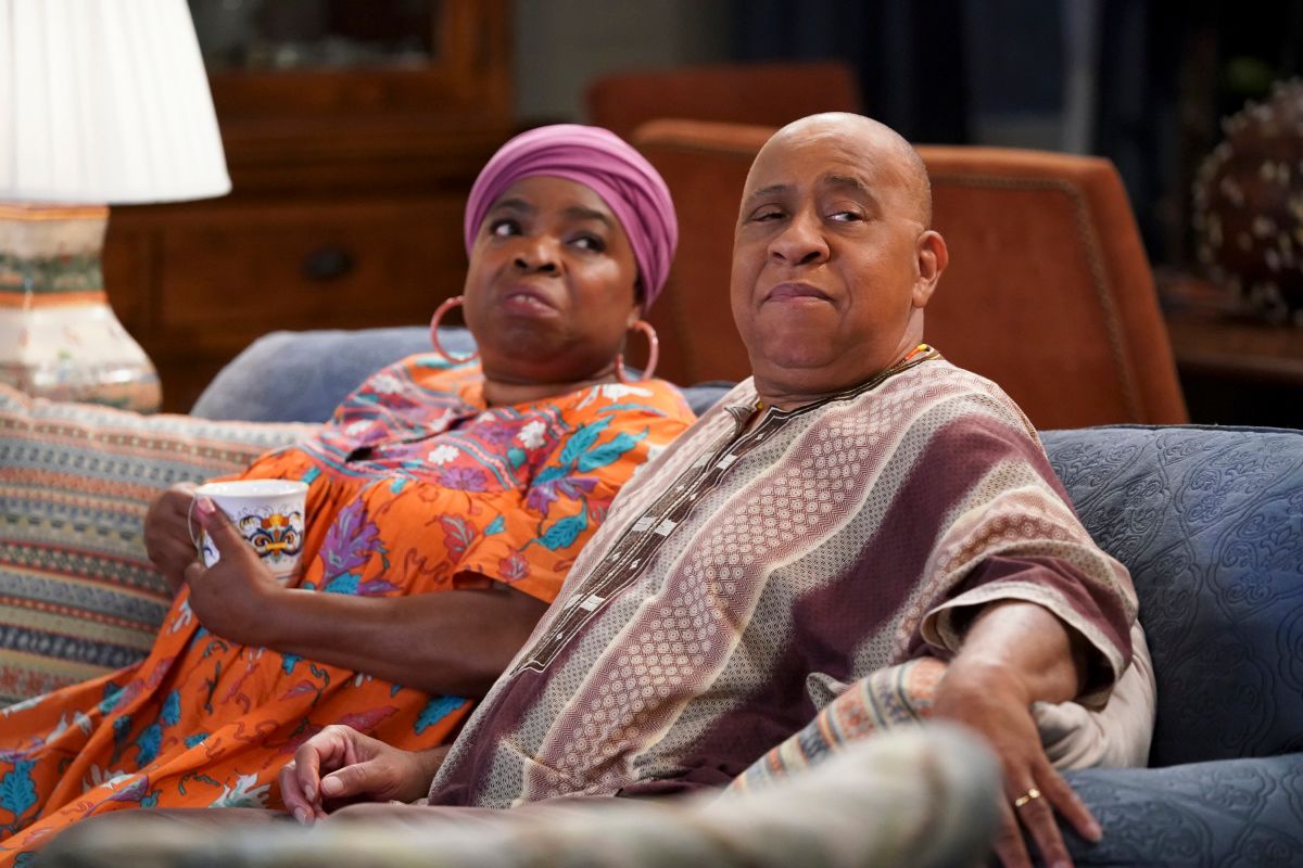 Shola Adewusi and Barry Shabaka Henley on the sofa in Bob Hearts Abishola